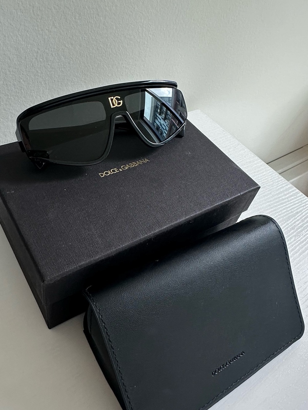 Dolce & Gabbana Black Shield Sunglasses with Gold DG Emblem